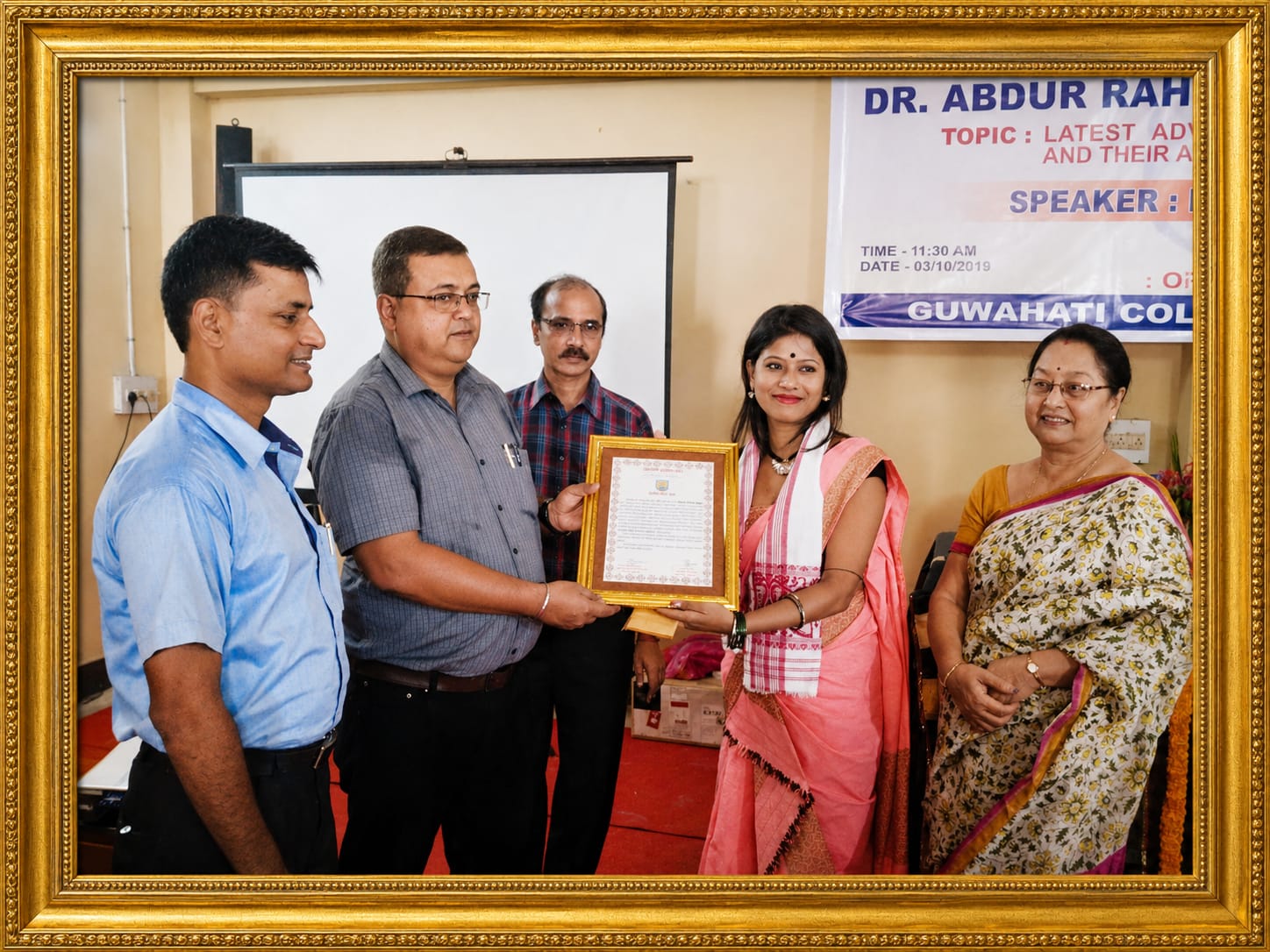 Minakshi Kalita receiving academic recognition at Guwahati College